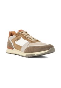 Brown suede sneaker with cream and white accents, featuring a textured surface, round toe, and beige laces. Raised heel and rubber sole.