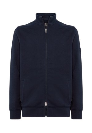 Giacca zip-up blu navy realizzata in tessuto morbido, caratterizzata da un colletto alto, tasche laterali e polsini a costine per una vestibilità aderente.