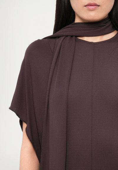 Dark purple, lightweight fabric top with short sleeves and draped detail around the neck, featuring subtle stitch lines. Smooth texture.