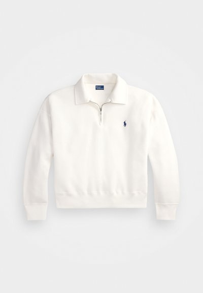 White pullover sweatshirt with a zipper, collar, and ribbed hem. Features a small navy logo on the left chest, made from soft fabric.