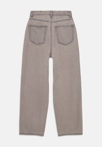 Gray denim jeans feature a straight-leg design, five-pocket styling, and visible stitching. The fabric has a soft texture and minimal wear.