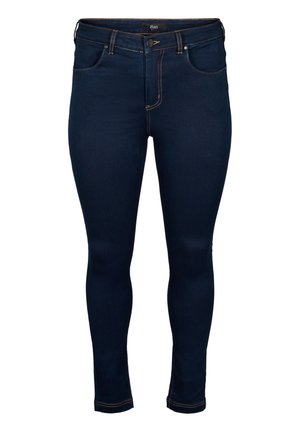 Dark blue skinny jeans with a smooth texture, standard five-pocket design, stitched accents, and a button fly.