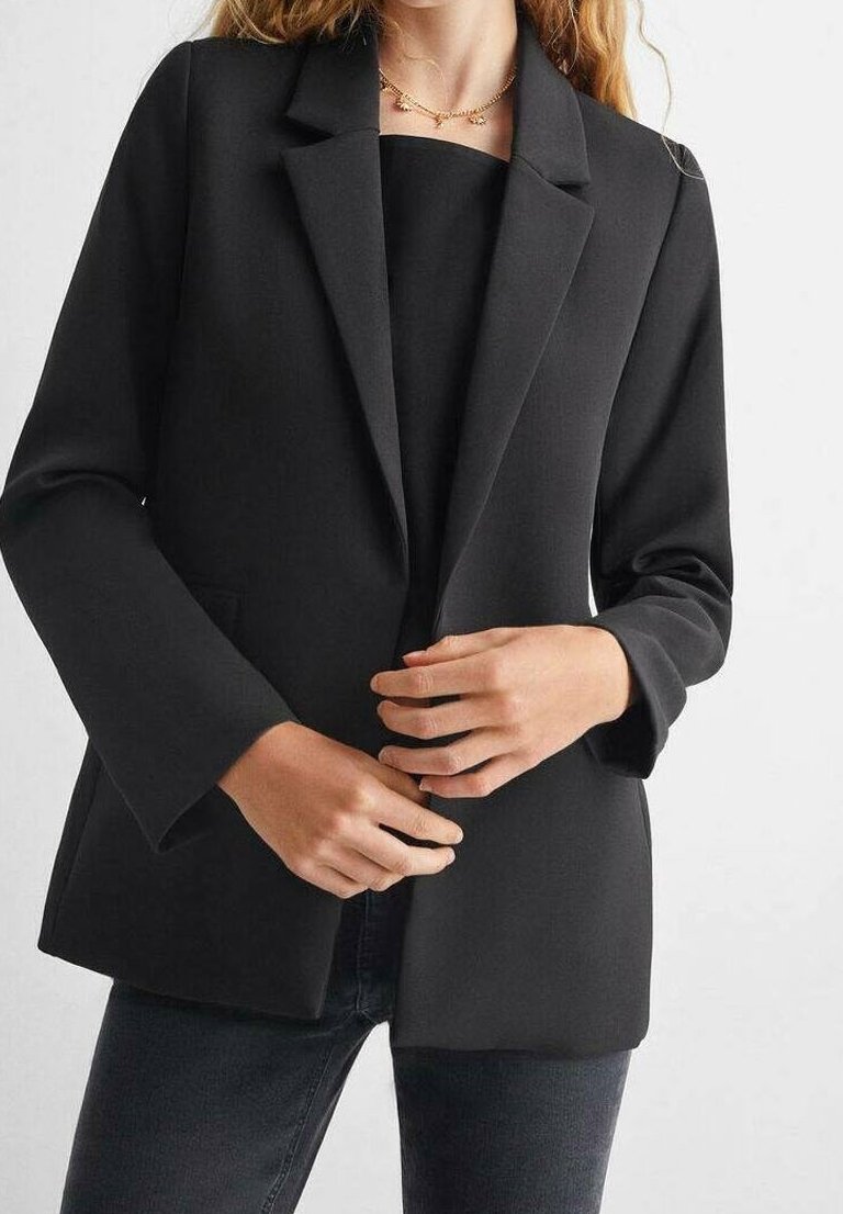 Black blazer with a tailored design, featuring notched lapels, long sleeves, and a smooth texture. Styled with a simple black top underneath.
