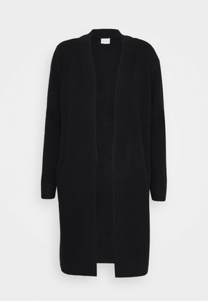 Cardigan lungo nero realizzato in materiale a maglia testurizzato, con chiusura aperta, maniche lunghe e due tasche laterali. Senza chiusure.