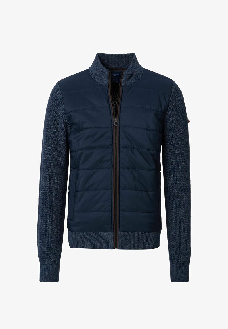 Marineblauer Reißverschlussjacke mit gepolstertem Vorderteil und strukturierten Strickärmeln, ausgestattet mit Stehkragen und gerippten Bündchen für eine verbesserte Passform.