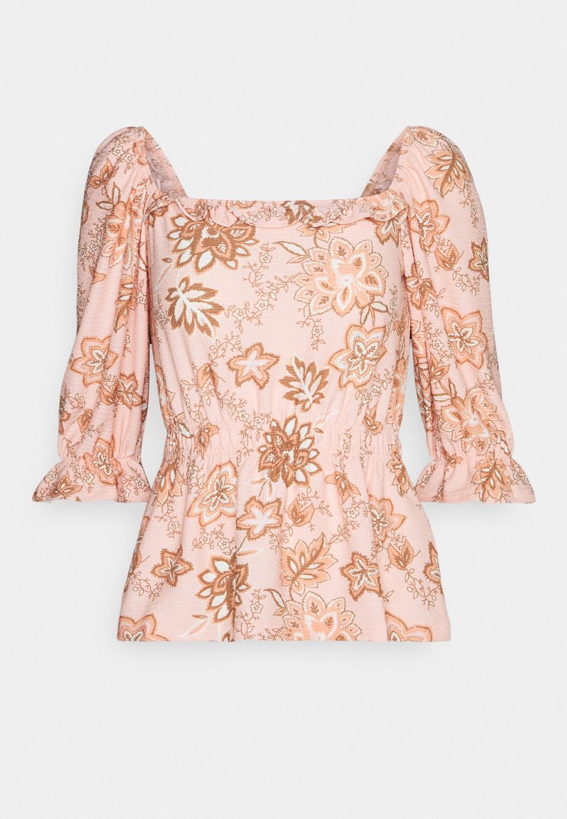 Blouse rose avec motifs floraux marron et beige, décolleté carré, manches 3/4 bouffantes et détail de taille élastique.