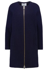 Cappotto di lana blu navy con colletto rotondo, maniche lunghe, chiusura con zip dorata e due tasche laterali. Tessuto morbido e vestibilità oversize.