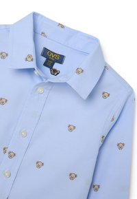 Lichtblauwe shirt met een kraag, voorzien van een patroon van kleine berengezichten. Gemaakt van zachte stof met knoopsluitingen en een gladde textuur.