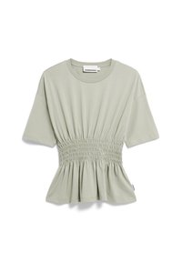 Světle zelené tričko s volným střihem, které má stažený elastický pás pro peplum tvar a krátké rukávy. Hladká bavlněná látka.