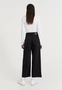 PULL&BEAR Jeans a zampa - black