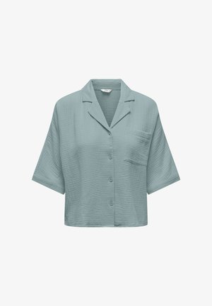 Šviesiai mėlyna trumpomis rankovėmis marškiniai su tekstūruota medžiaga, su žvyneliu apykakle, priekiniais mygtukais ir viena krūtinės kišene.