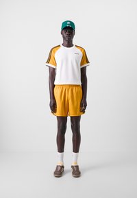 adidas Originals 80S SPRINT - Treniņtērpa apakšdaļas - orange