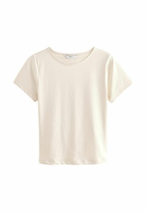 Lühikeste varrukatega ümar kaelusega T-särk pehmes, heledas beežis riidis. Lihtne disain otse lõikega, ilma mustrite või aktsentideta.