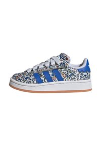 Floral-patterned Adidas sneakers with a white base, blue stripes, and a gum sole. Features laces and a padded tongue for comfort.