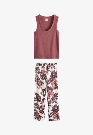 Ærmeløs, ribstrikket tanktop i mauve kombineret med hvide bukser med vide ben, dekoreret med store bordeaux blomster- og bladmønstre.