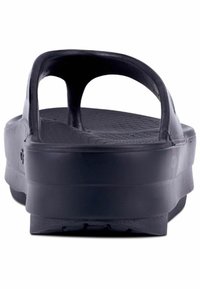 Black rubber slide sandal with open back, textured insole, and a thick platform sole; angled for rear view.
