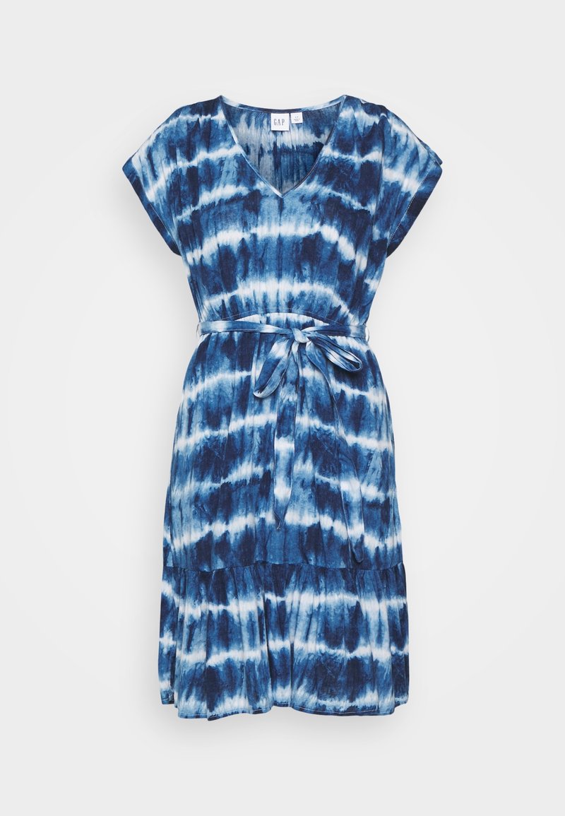 Blaue Batik-Kleid mit kurzen Ärmeln, einem V-Ausschnitt und einem Taillenband. Verfügt über einen gestuften Rock mit unterschiedlichen Blautönen und weißen Mustern.