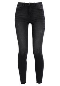 Vaqueros skinny negros de talle alto, con una textura desgastada y un ligero desvanecimiento. Confeccionados en denim con bolsillos tradicionales.