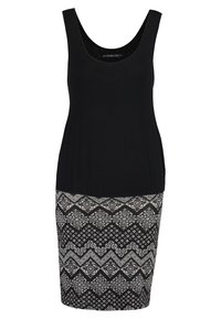 Robe noire sans manches avec un haut ajusté et une jupe noire et blanche à motifs présentant des formes géométriques et des accents floraux.