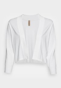 Biały krótki kardigan o luźnym kroju, z otwartym przodem i długimi rękawami. Wykonany z miękkiego materiału o prążkowanej teksturze i minimalnych detalach.