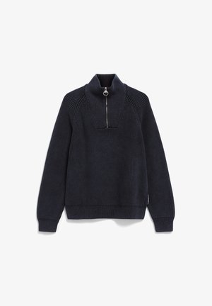 Marineblauwe geribbelde gebreide trui met een hoge kraag en een voormet rits met een ronde metalen trekhaak.