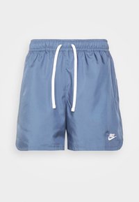 Blå atletiska shorts gjorda av slät tyg med ett vitt snöre och en liten vit logotyp på nedre vänstra sidan.