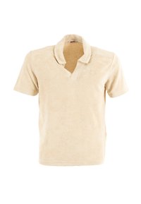 Polo shirt beige realizzato in morbido tessuto in spugna. Presenta un colletto corto, maniche corte e un piccolo logo sul petto. Finitura liscia e testurizzata.