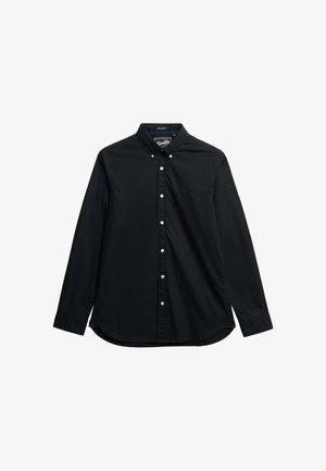 Zwarte lange mouwen shirt van katoen, met een button-down kraag, witte knopen en een afgeronde zoom. Subtiel geborduurd logo op de borst.