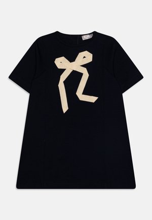 Granatowy bawełniany T-shirt z krótkimi rękawami i dużym kremowym wzorem wstążki na przodzie. Posiada okrągły dekolt i prosty dół.