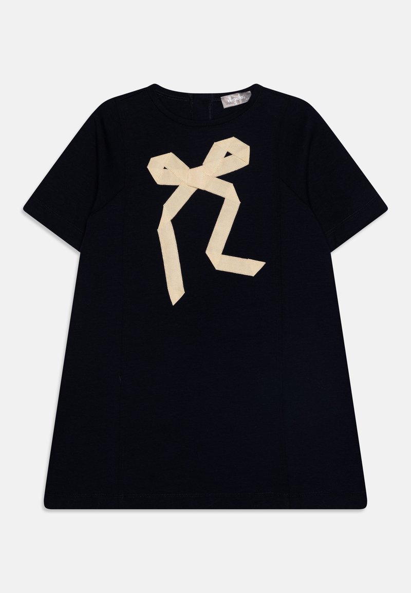 T-shirt en coton marine à manches courtes avec un grand motif de ruban crème sur le devant. Il présente un col rond et un ourlet droit.