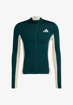 Långärmad atletisk zipjacka i mörk teal med off-white sidopaneler. Har en ståkrage och adidas-logotyp på bröstet.