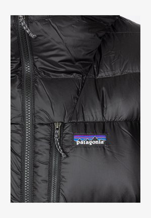 Black insulated puffer jacket with a detachable hood, featuring a zipper front, two zippered pockets, and the Patagonia logo on the chest.