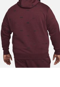 Maroon hooded sweatshirt with black Nike logos throughout. Features ribbed cuffs and hem, soft texture, and a relaxed fit.