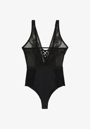 Bodysuit noir avec des panneaux en dentelle, un décolleté en V profond et un détail croisé au dos. Tissu doux avec une texture en dentelle florale sur les côtés et à l'avant.
