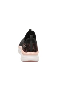 Black athletic shoe with a textured knitted upper, rear pull tab, and white and pink rubber sole. Features a sleek, slip-on design.