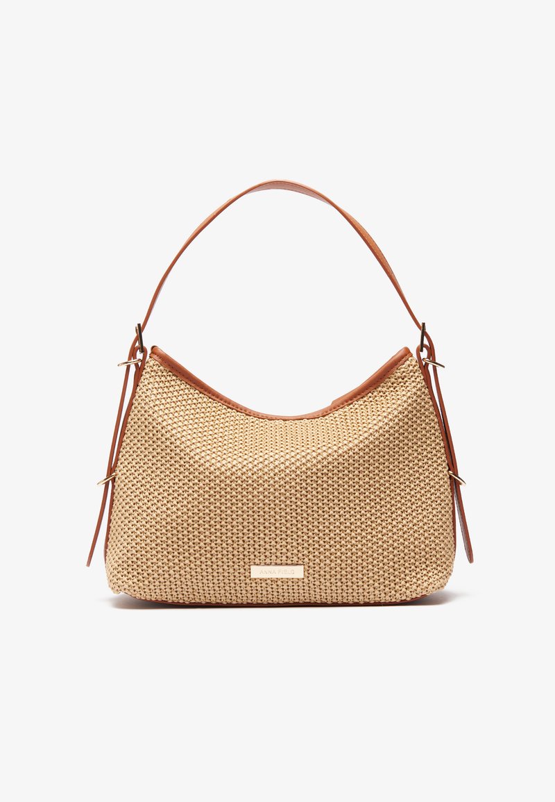 Tan woven bag with a curved shape, leather accents, and a single shoulder strap. Features a gold logo detail on the front.