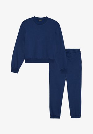 Dunkelblaue Sweatshirts und Jogginghosen Set, aus weichem Material gefertigt. Das Sweatshirt hat einen Rundhalsausschnitt und einen gerippten Saum; die Jogginghose verfügt über einen elastischen Bund.