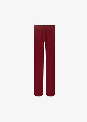 Pantalones de pierna ancha rojos, hechos de una tela suave con una textura lisa. Presentan un color sólido y una cinturilla elástica para mayor comodidad.