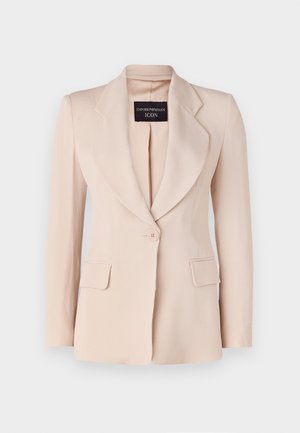 Lys pink blazer med skræddersyet pasform, klapkraver, enkelt knaplukning og to forreste påsyede lommer. Lavet af ribbet stof.