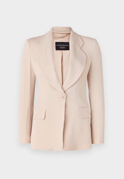 Világos rózsaszín zakó, testre szabott fazonnal, kivágott hajtókákkal, egy gombos záródással és két elülső zsebbekkel. Ráadásul bordázott anyagból készült.