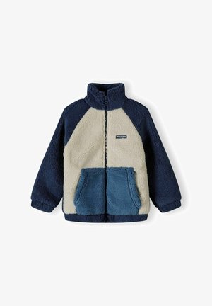 Fleece jopica z visokim ovratnikom, ki vključuje kreme, mornarsko modro in teal odseke. Dve sprednji žepni in zadrgo. Mehka tekstura.