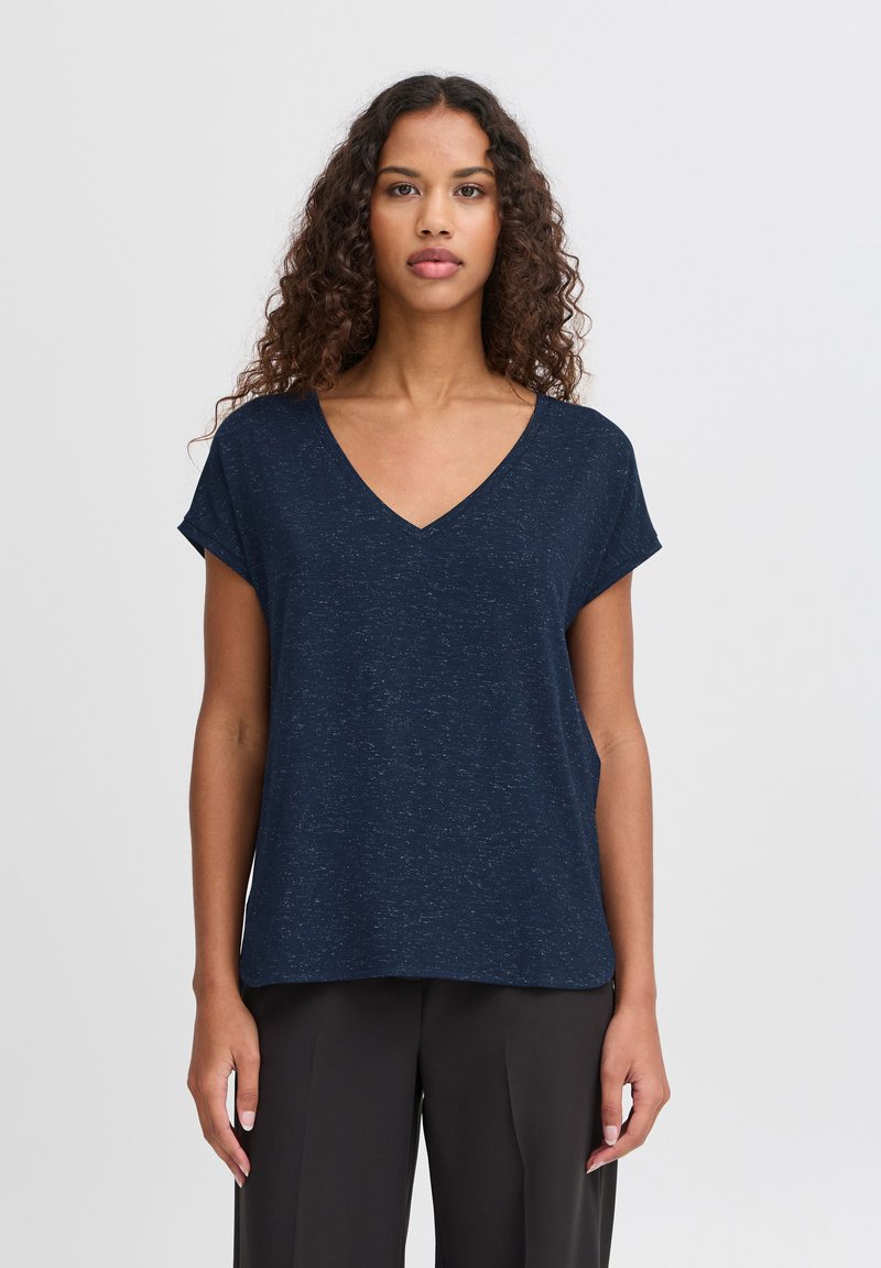 Navy blue short-sleeve top in a relaxed fit with a V-neckline, made from a soft, textured fabric featuring a subtle speckled pattern.