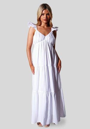 Vestido maxi blanco confeccionado en tela ligera, con mangas con volantes, escote en V y capas fruncidas, con una silueta fluida y relajada.