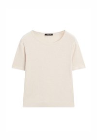 T-shirt en coton crème à manches courtes avec encolure ronde et étiquette de marque visible à l'intérieur du col.