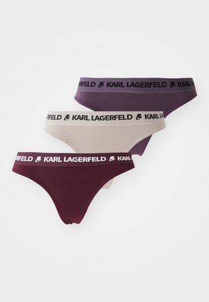 Tri par ženskih hlačk v temno vijolični, bež in burgundski barvi. Vsak par je izdelan iz mehkega blaga in ima elastičen pas z blagovno znamko.