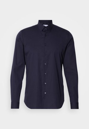 Navy button-up shirt with long sleeves, classic collar, and a slim fit design. Made of smooth fabric with a subtle logo on the chest.