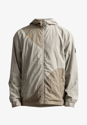 Giacca leggera con cappuccio in beige e taupe, caratterizzata da un design geometrico, chiusura con zip e polsini regolabili. Realizzata in tessuto testurizzato.