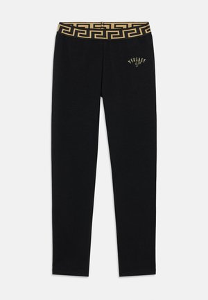 Čierne legíny s pásom v zlatej vzorovanej farbe a malým vyšívaným logom na boku. Vyrobené z mäkkej, pružnej látky.