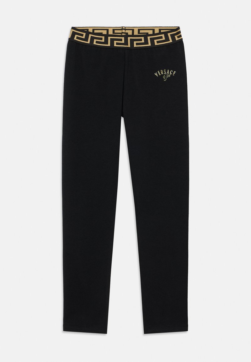 Juodos tamprės su auksiniu raštuotu juosmeniu ir mažą siuvinėtą logotipą šone. Pagamintos iš minkšto, tampraus audinio.