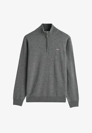 Sudadera gris con cremallera, hecha de suave tejido de punto. Presenta un cuello alto y puños y dobladillo acanalados. Logo pequeño en el pecho.